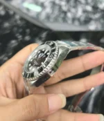 Side view showcasing the satin finish of the Rolex Submariner Date 126610LN 41MM with a black dial and ceramic bezel.