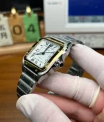 Close-up of Cartier Santos W2SA0007 two-tone watch crown and case detail