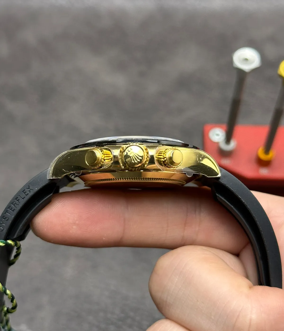 Close-up of the crown on the Rolex Cosmograph Daytona M116518LN-0048 replica watch showing polished detail