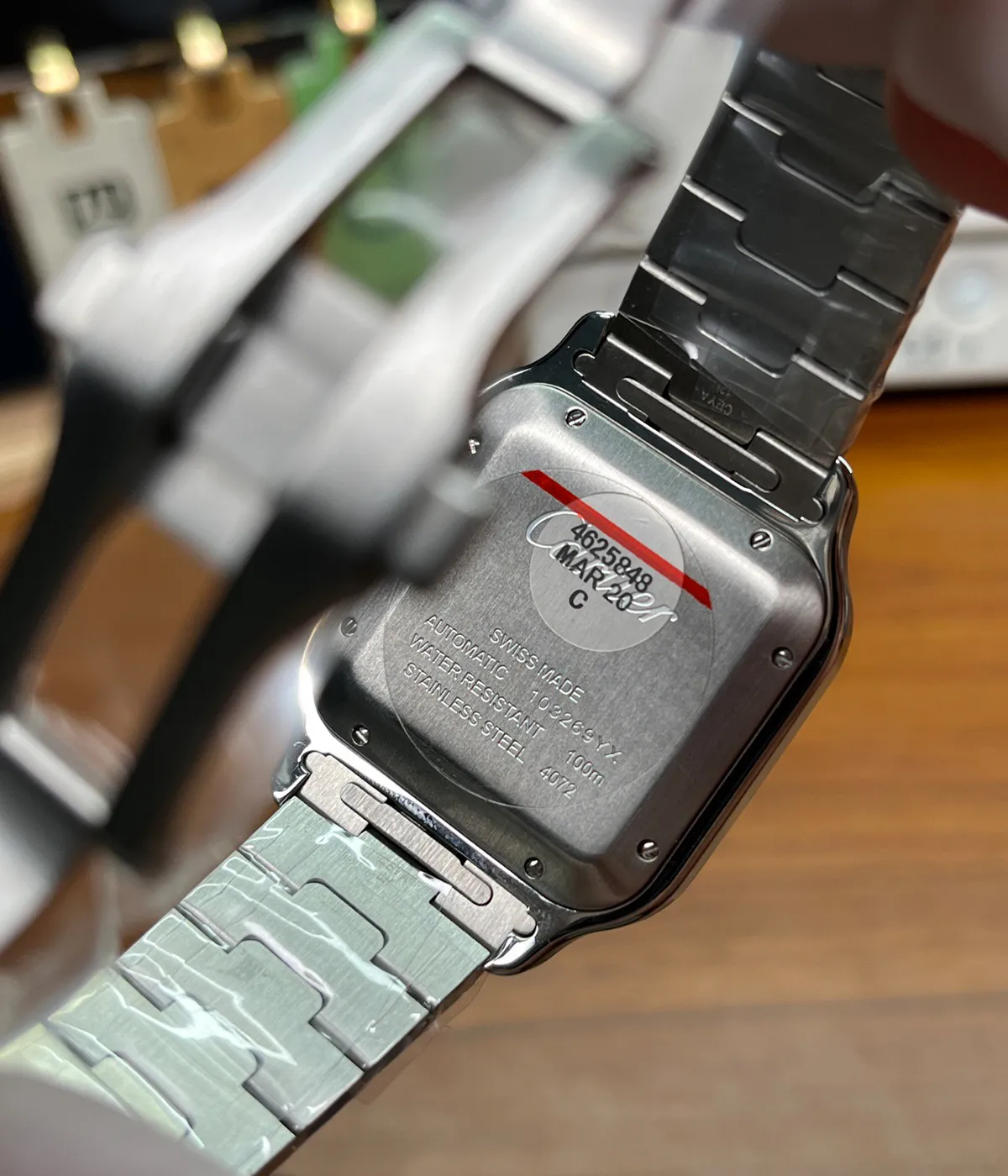 Caseback display of Cartier Santos WSSA0030 showing movement and back case details