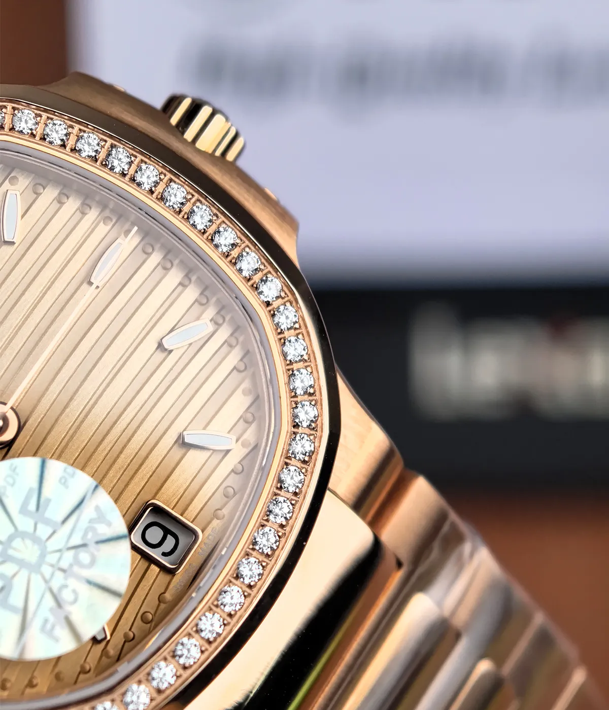 Close-up of the diamond-set bezel on Patek Philippe Nautilus 7118R-001 rose gold replica