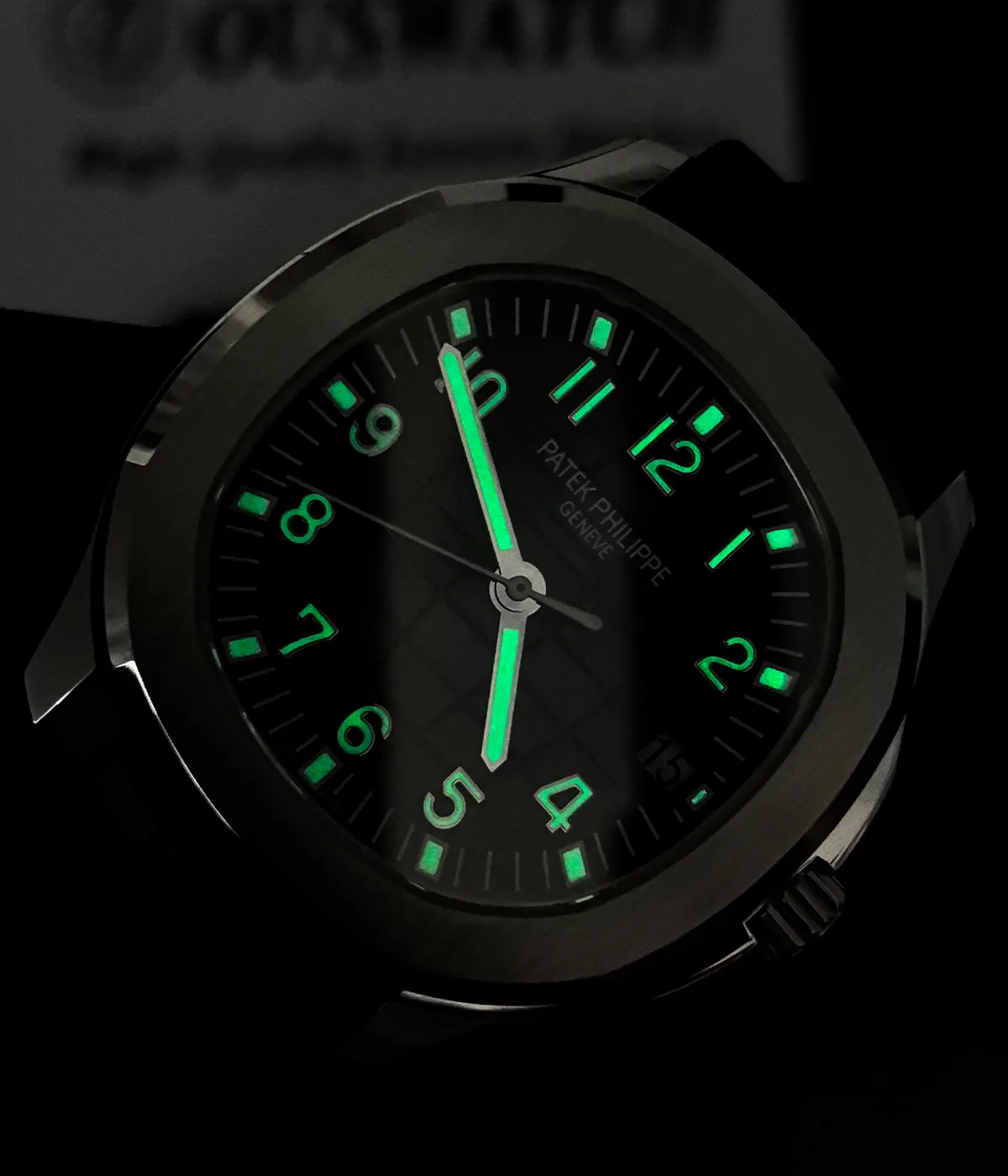 Patek Philippe Aquanaut 5167A-001 replica watch showing luminescent markers in low light for enhanced readability